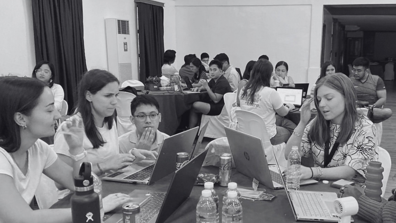 Foundry for Good colleagues collaborating around laptops